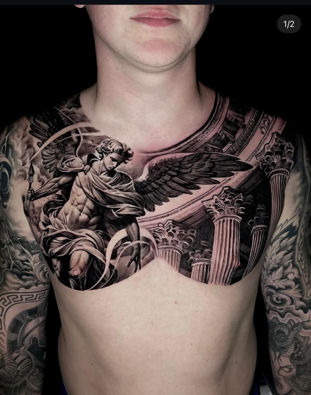 Black and grey realism archangel chest tattoo