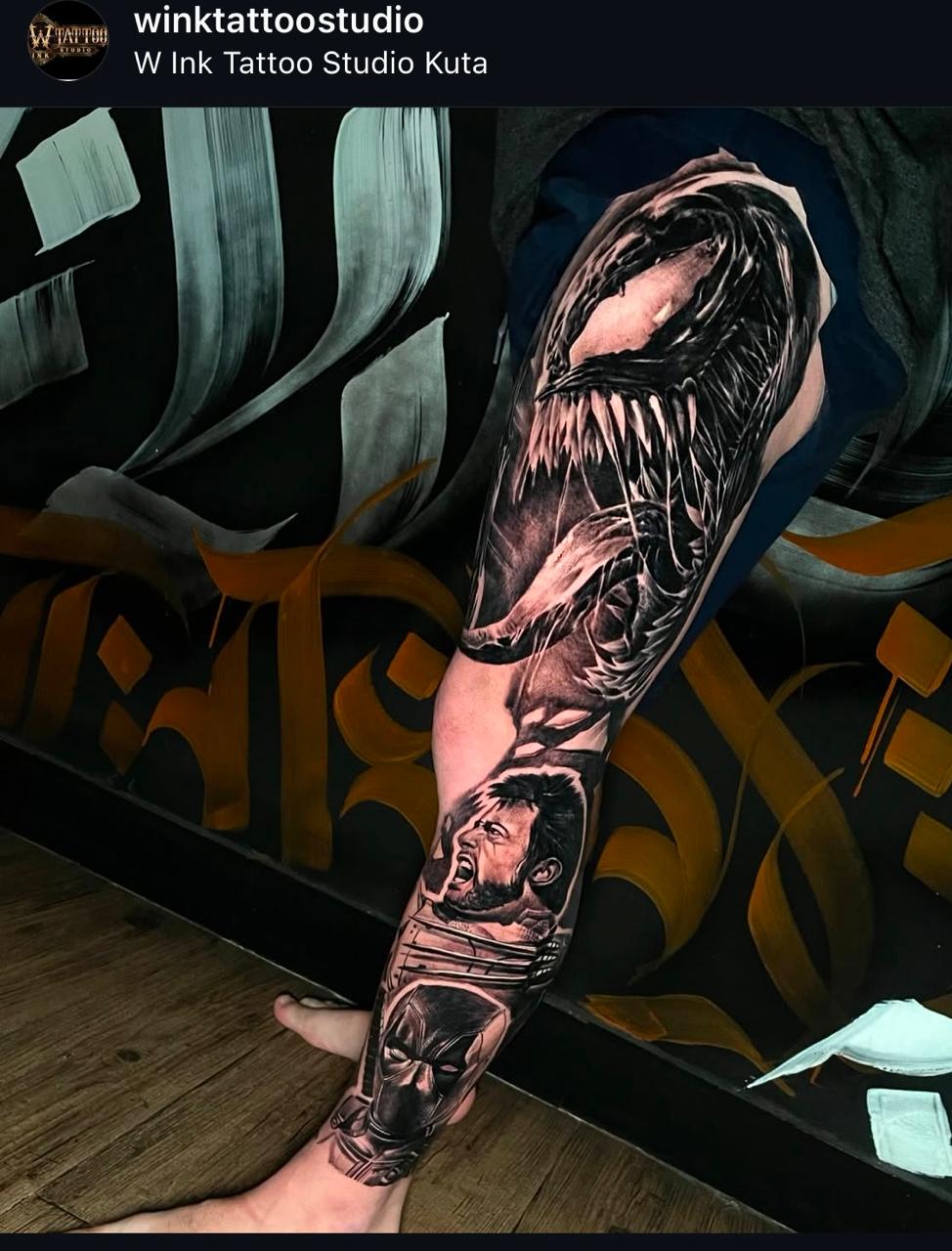 Black and grey realism Marvel sleeve tattoo